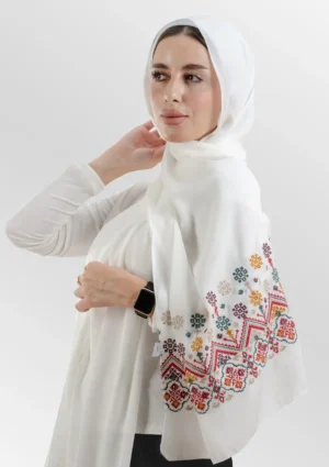 The Ziczak Ivory Floral Tatreez Shawl is a soft, breathable embroidered hijab made from crepe fabric with delicate detailing—ideal for daily wear and special occasions.