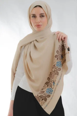 The Joury Dark Beige Rose Petals Tatreez Shawl is a soft, breathable embroidered hijab made from crepe fabric with delicate detailing—ideal for daily wear and special occasions.