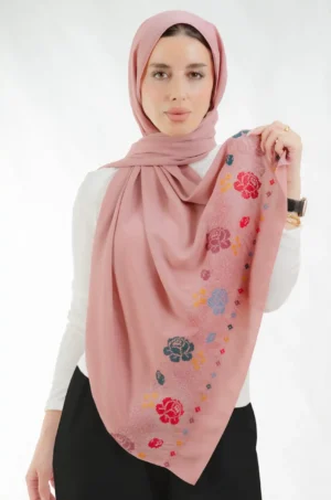 The Joury Dirty Rose Petals Tatreez Shawl is a gentle, airy embroidered hijab made from crepe fabric with fine craftsmanship—perfect for everyday use and special events.