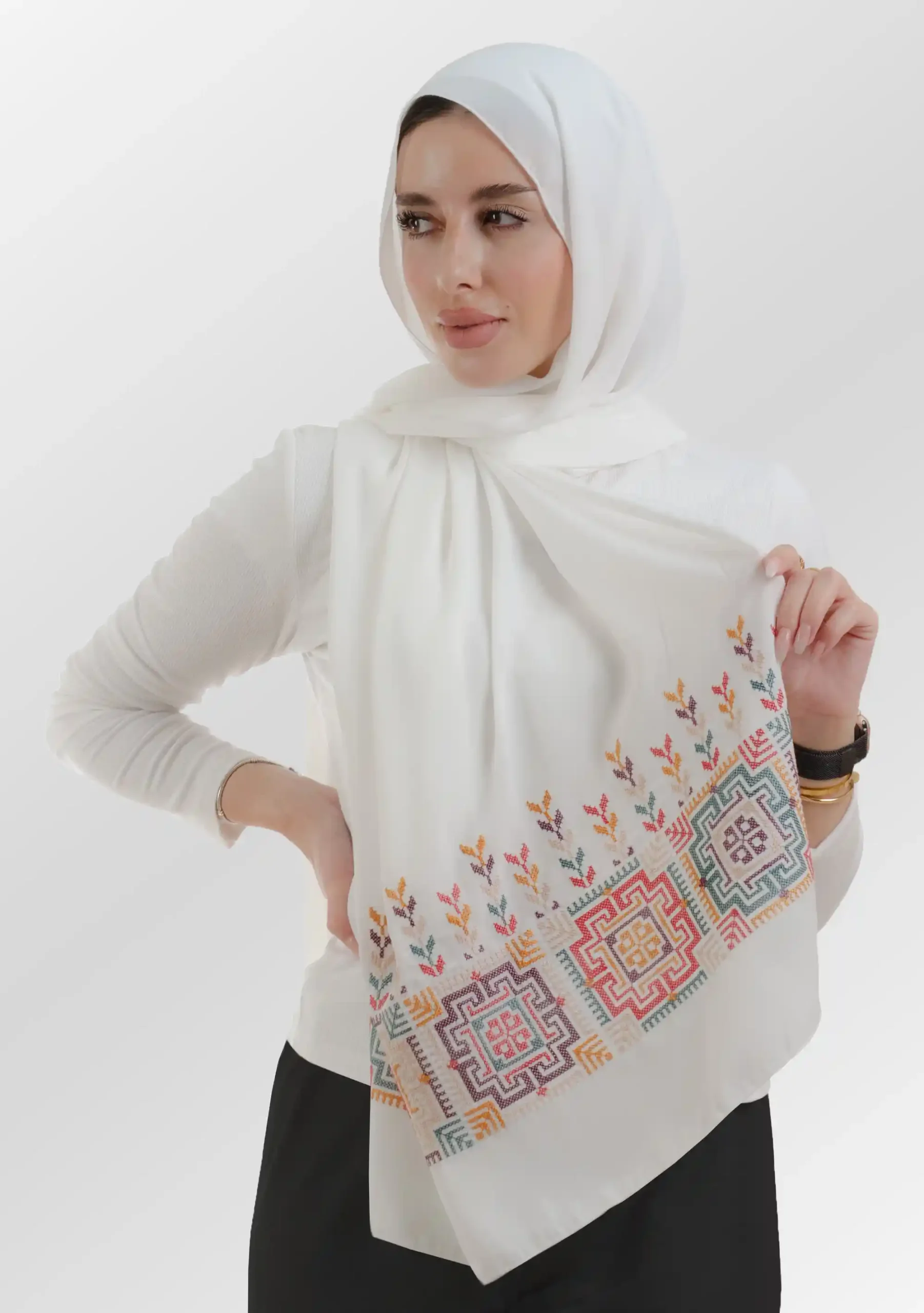 The Fallahi Mix ivory Tatreez Shawl is a cozy, well-ventilated embroidered hijab made from crepe fabric with meticulous handiwork—great for day-to-day wear and celebrations.