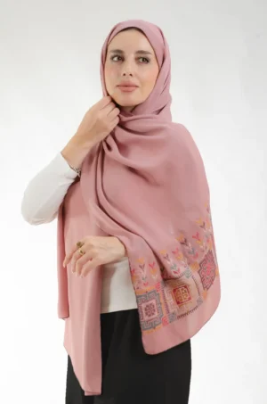 The Fallahi Mix Dirty Rose Tatreez Shawl is a plush, feather-light embroidered hijab made from crepe fabric with elegant accents—perfect for daily wear and elegant outings.
