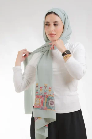 The Fallahi Mix Mint Tatreez Shawl is a silky, fresh embroidered hijab made from crepe fabric with delicate stitching—excellent for regular use and dressy affairs.