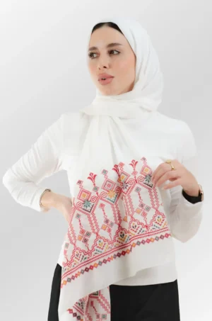 The Shamadan Cream Candlestick Tatreez Shawl is a gentle, airy embroidered hijab made from crepe fabric with fine craftsmanship—perfect for everyday use and special events.