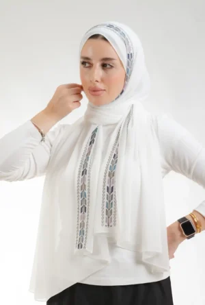 The Sabalah Cream Tatreez Shawl is a plush, feather-light embroidered hijab made from chiffon fabric with elegant accents—perfect for daily wear and elegant outings.