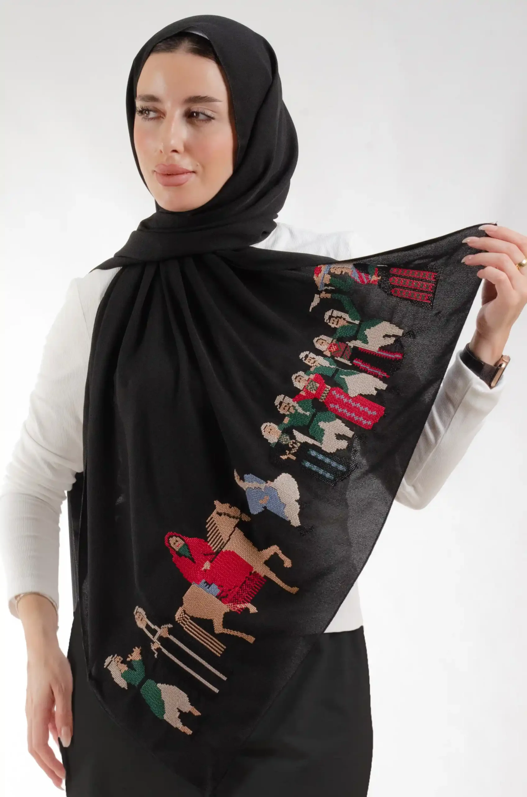 The Palestine Wedding Black Tatreez Shawl is a cozy, well-ventilated embroidered hijab made from chiffon fabric with meticulous handiwork—great for day-to-day wear and celebrations.