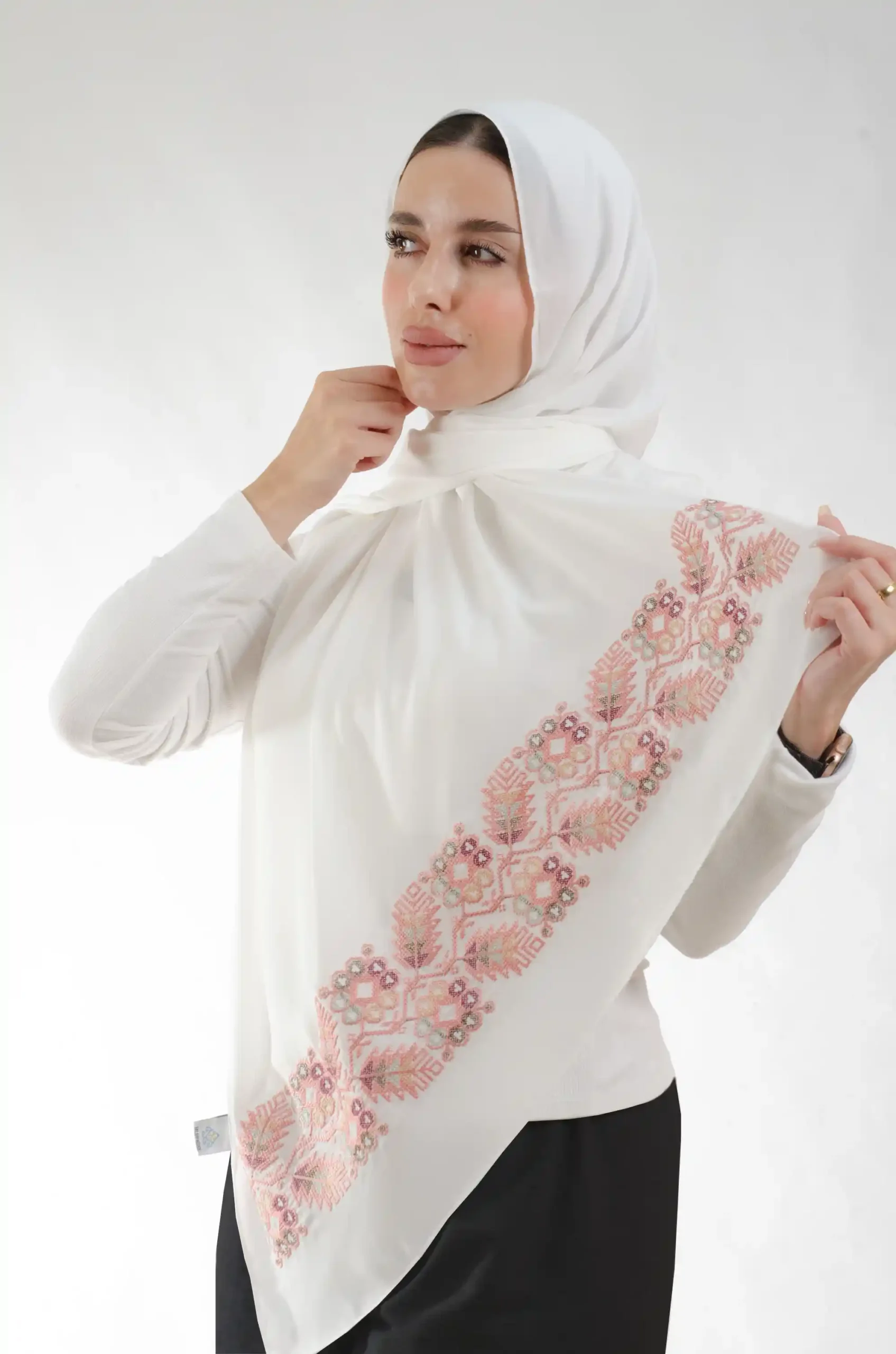 The Pine Pearl Tatreez Shawl is a silky, fresh embroidered hijab made from crepe fabric with delicate stitching—excellent for regular use and dressy affairs.