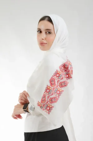 The Pine Alabaster Tatreez Shawl is a gentle, airy embroidered hijab made from crepe fabric with fine craftsmanship—perfect for everyday use and special events.