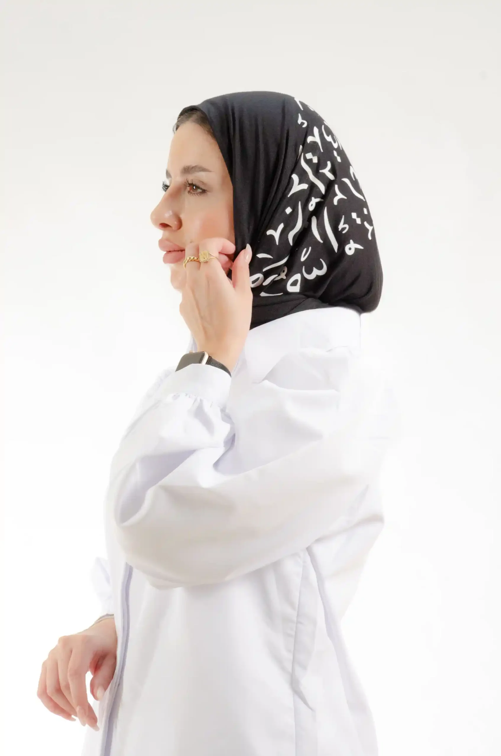 The Printed Black Arabic Letters Trianlge Shawl is a silky, fresh embroidered hijab made from qotton fabric with delicate stitching—excellent for regular use and dressy affairs.