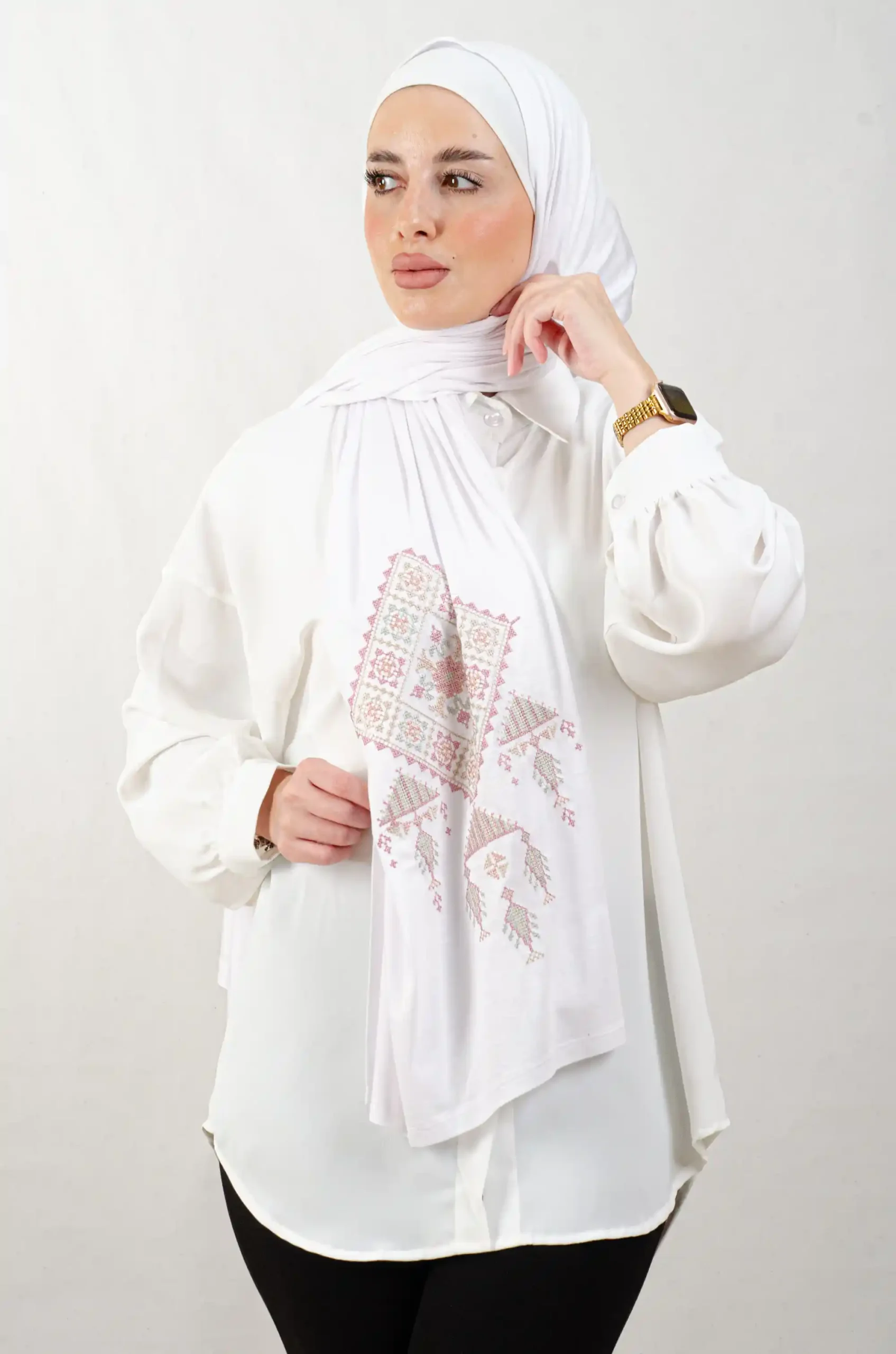 The Rose Bethlehem Tatreez Shawl is a cozy, breathable embroidered hijab made from cotton fabric—perfect for everyday wear and celebrations.