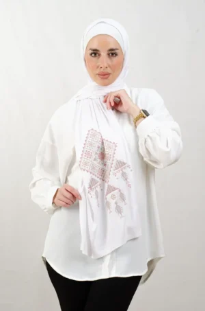 The Rose Bethlehem Tatreez Shawl is a cozy, breathable embroidered hijab made from cotton fabric—perfect for everyday wear and celebrations.