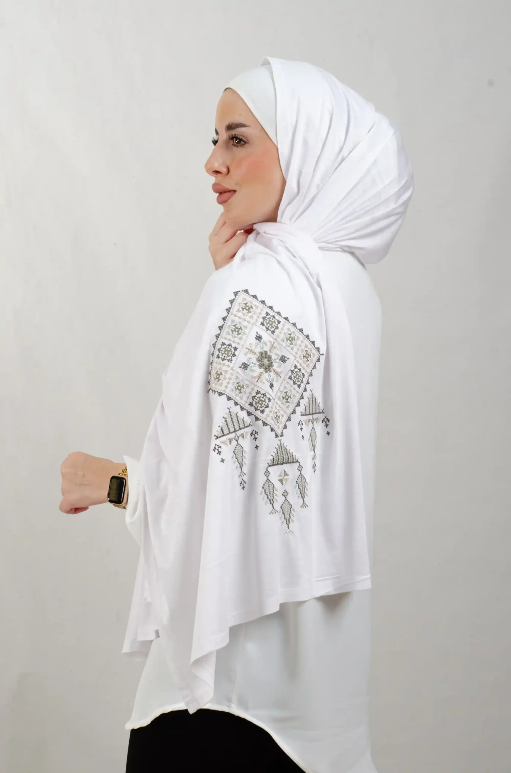 The Olive Bethlehem Tatreez Shawl is a cozy, breathable embroidered hijab made from cotton fabric—perfect for everyday wear and celebrations.