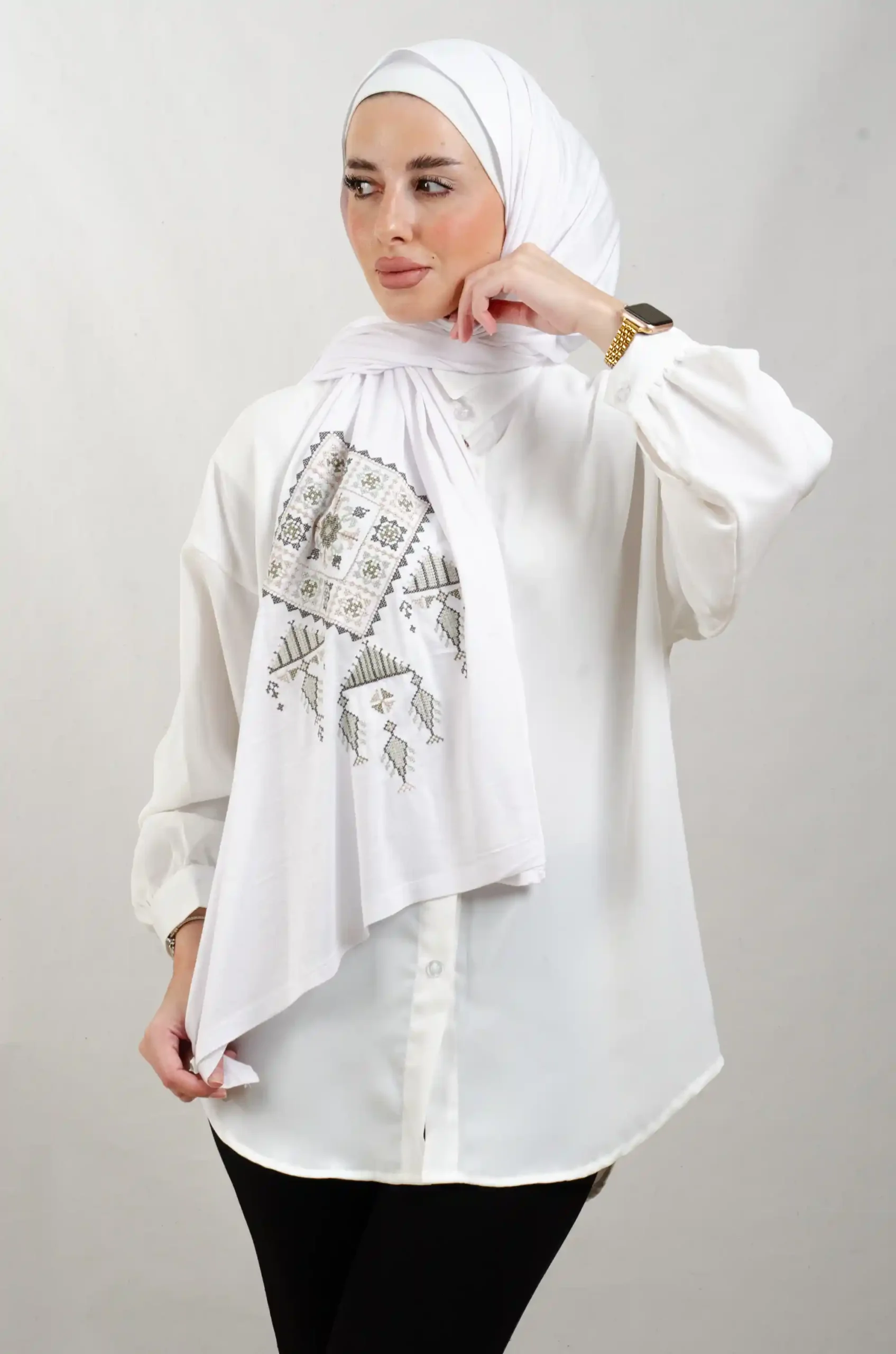 The Olive Bethlehem Tatreez Shawl is a cozy, breathable embroidered hijab made from cotton fabric—perfect for everyday wear and celebrations.