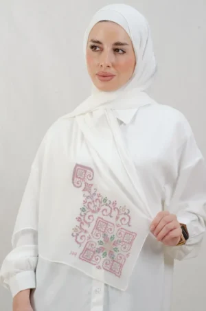 The Rose Hebron Tatreez Shawl is a cozy, breathable embroidered hijab made from Georgette chiffon fabric. Perfect for everyday wear and celebrations.