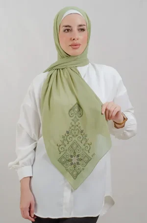 The Green Hebron Tatreez Shawl is a cozy, breathable embroidered hijab made from Georgette chiffon fabric. Perfect for everyday wear and celebrations.