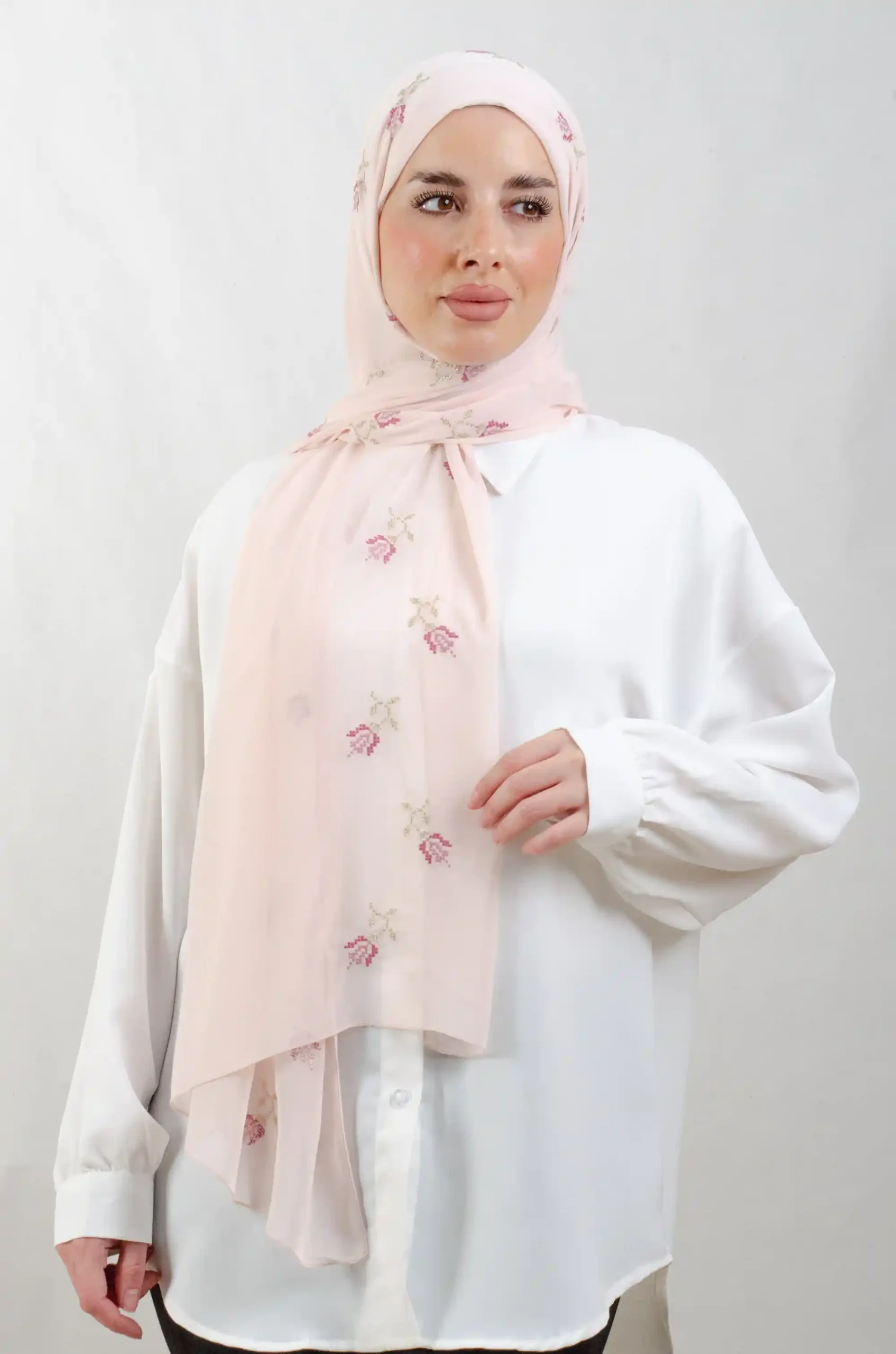 The Lilac Rose Tatreez Shawl is a cozy, breathable embroidered hijab made from Georgette chiffon fabric. Perfect for everyday wear and celebrations.