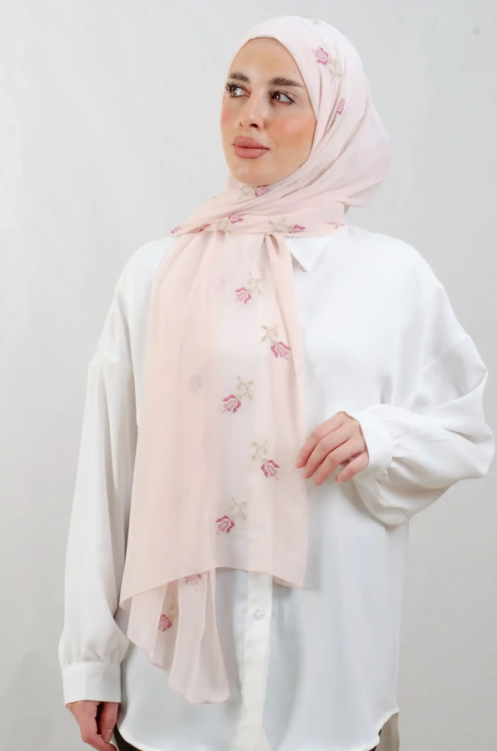 The Lilac Rose Tatreez Shawl is a cozy, breathable embroidered hijab made from Georgette chiffon fabric. Perfect for everyday wear and celebrations.