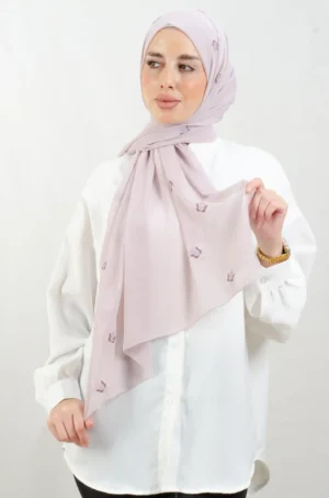 The Lilac purple Tatreez Shawl is a cozy, breathable embroidered hijab made from Georgette chiffon fabric. Perfect for everyday wear and celebrations.