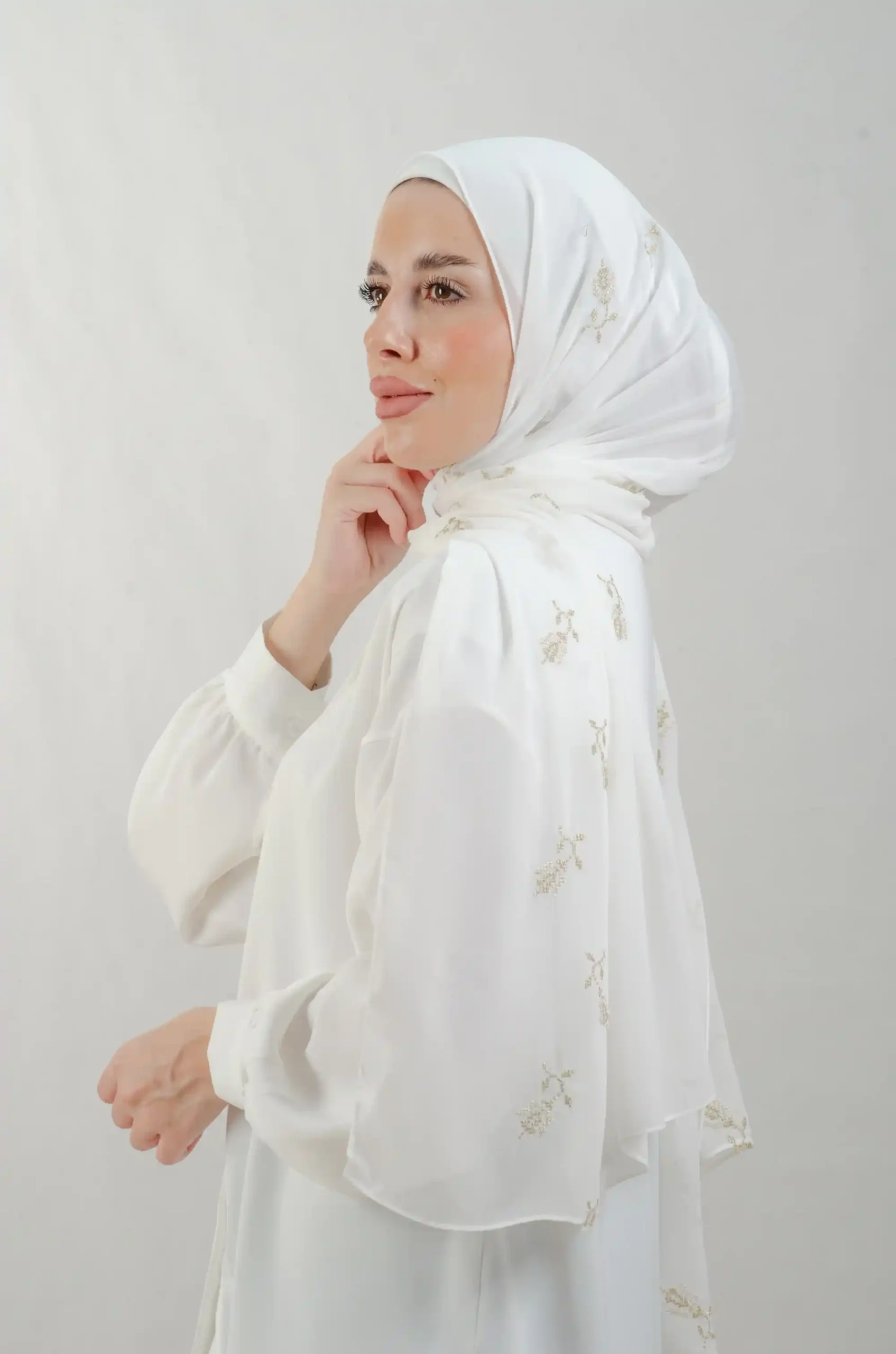 The Lilac Metal Tatreez Shawl is a cozy, breathable embroidered hijab made from Georgette chiffon fabric. Perfect for everyday wear and celebrations.