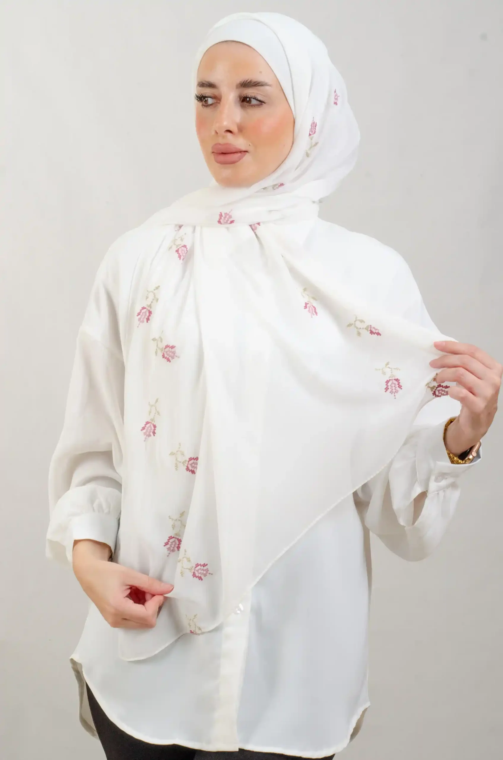The Lilac Light Rose Tatreez Shawl is a cozy, breathable embroidered hijab made from Georgette chiffon fabric. Perfect for everyday wear and celebrations.