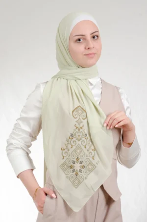 The Green Hebron Tatreez Shawl is a cozy, breathable embroidered hijab made from Georgette chiffon fabric. Perfect for everyday wear and celebrations.