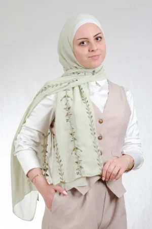 The Cypress Vine Green Tatreez Shawl is a cozy and breathable embroidered hijab crafted from premium Georgette chiffon fabric. Designed with elegant Tatreez embroidery in Cypress Vine Green, it offers a graceful drape and lightweight comfort. Perfect for daily wear as well as festive gatherings and celebrations.