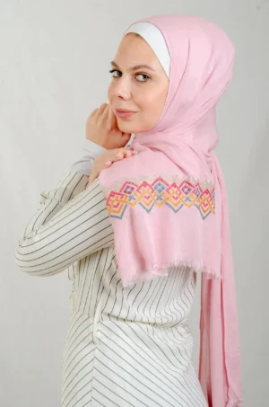 The Mountain Modal Rose Tatreez Shawl is a cozy and breathable embroidered hijab made from high-quality cotton fabric. Designed with the classic Mountain motif in Rose, it offers a graceful drape and natural comfort. Perfect for everyday wear, festive gatherings, and special occasions, this shawl brings elegance and heritage together.