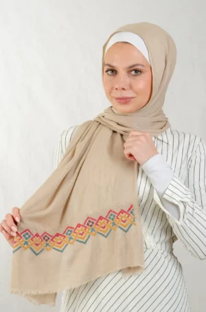 The Mountain Modal Beige Tatreez Shawl is a breathable and elegant embroidered hijab made from cotton fabric. Featuring the Mountain motif in Dark Beige, it provides a graceful drape and day-long comfort. Perfect for daily wear, festive occasions, and celebrations, it’s a stylish blend of tradition and elegance.