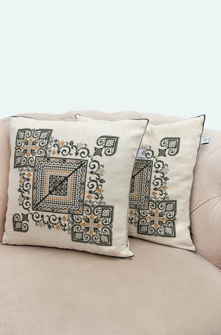A warm olive embroidered cushion set inspired by earthy Palestinian heritage tones—perfect for elegant home décor.