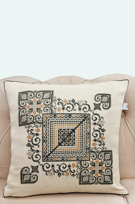 A warm olive embroidered cushion set inspired by earthy Palestinian heritage tones—perfect for elegant home décor.