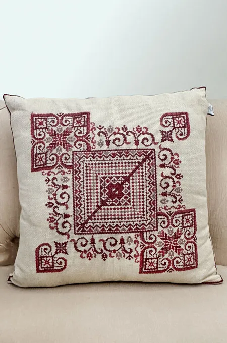 A bold red tatreez cushion set that adds richness, heritage, and a striking traditional touch.