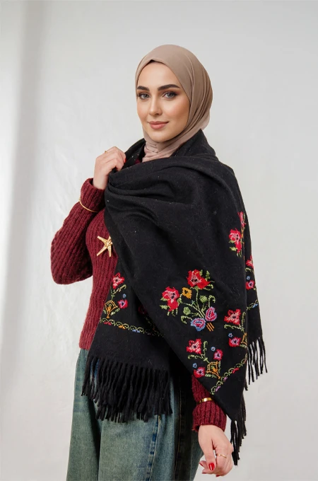 Black Jouri Embroidered Winter Shoulder Shawl in a warm winter design crafted from ultra-soft mohair fabric, featuring Jouri Falahi embroidery in a rich mix of traditional colors, inspired by authentic rural Palestinian heritage.