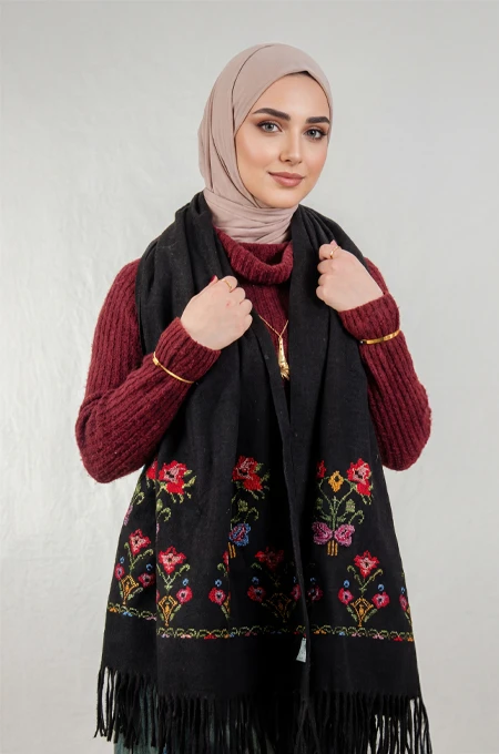 Black Jouri Embroidered Winter Shoulder Shawl in a warm winter design crafted from ultra-soft mohair fabric, featuring Jouri Falahi embroidery in a rich mix of traditional colors, inspired by authentic rural Palestinian heritage.