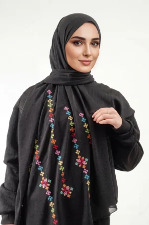 The Black-Mix Taif Embroidered Shawl features traditional fallahi embroidery in mixed colors on a classic black chiffon base with refined aghabani detailing. This embroidered shawl offers graceful movement and versatile styling while celebrating the beauty of Palestinian تطريز.