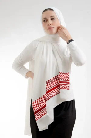 The Jordanian shemagh Tatreez Shawl is a plush, feather-light embroidered hijab made from crepe fabric with elegant accents—perfect for daily wear and elegant outings.