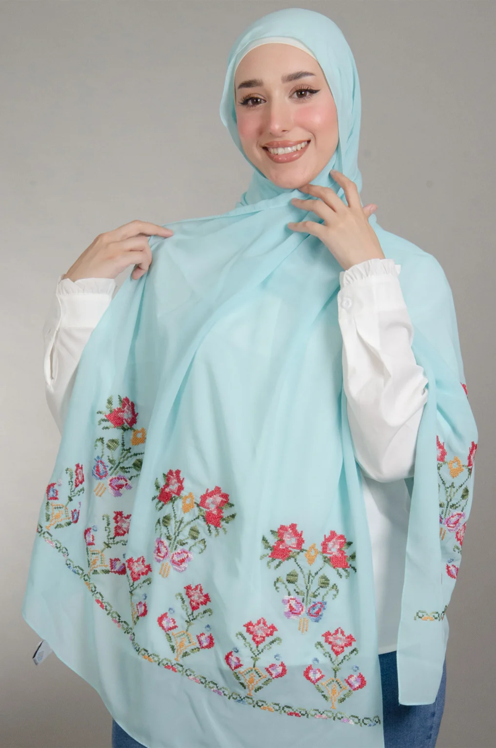Light Blue Henna Shawl made from Duja Al-Lail cotton chiffon with elegant heritage-inspired Falahi embroidery.