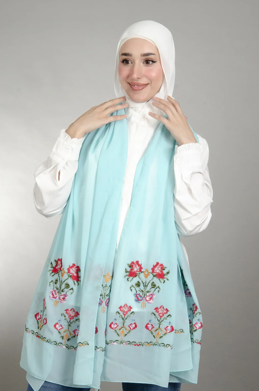Light Blue Henna Shawl made from Duja Al-Lail cotton chiffon with elegant heritage-inspired Falahi embroidery.